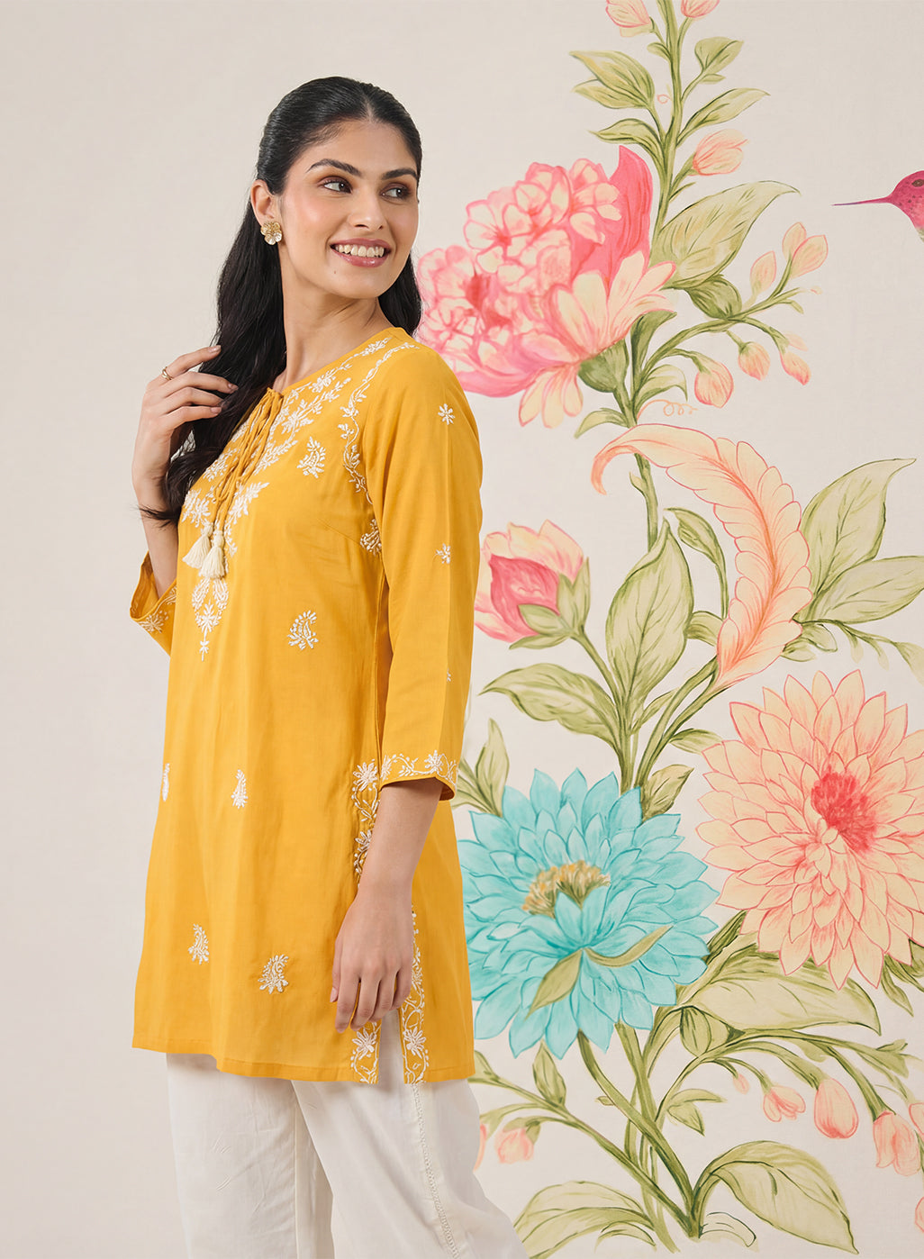 Afiya Yellow Cotton Blend Embroidered Kurti